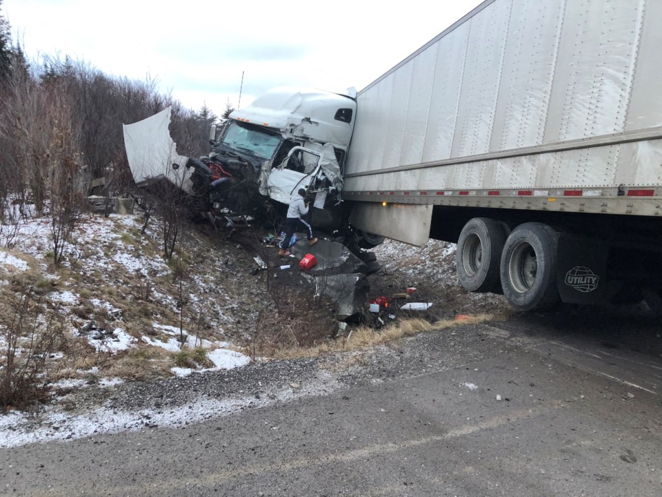Severely damaged transport truck after a highway crash in Ontario, highlighting the safety risks associated with the Driver Inc Canada model