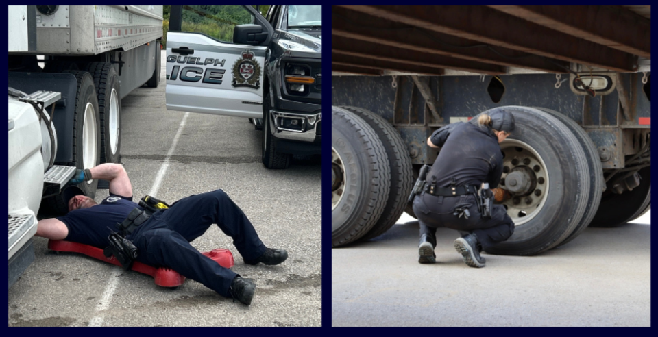 Ontario police conducting detailed truck inspections during a commercial vehicle safety blitz to ensure mechanical compliance and road safety. Two Ontario police officers inspect commercial transport trucks during a roadside safety blitz — one officer lying beneath a tractor inspecting brakes, the other kneeling to check wheel components on a trailer.